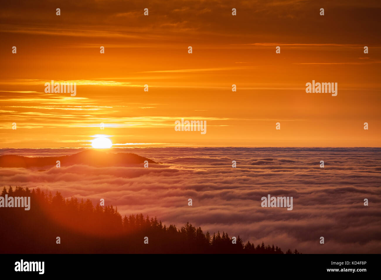 Sunrise over clouds in the mountain. Aerial view over misty and foggy ...