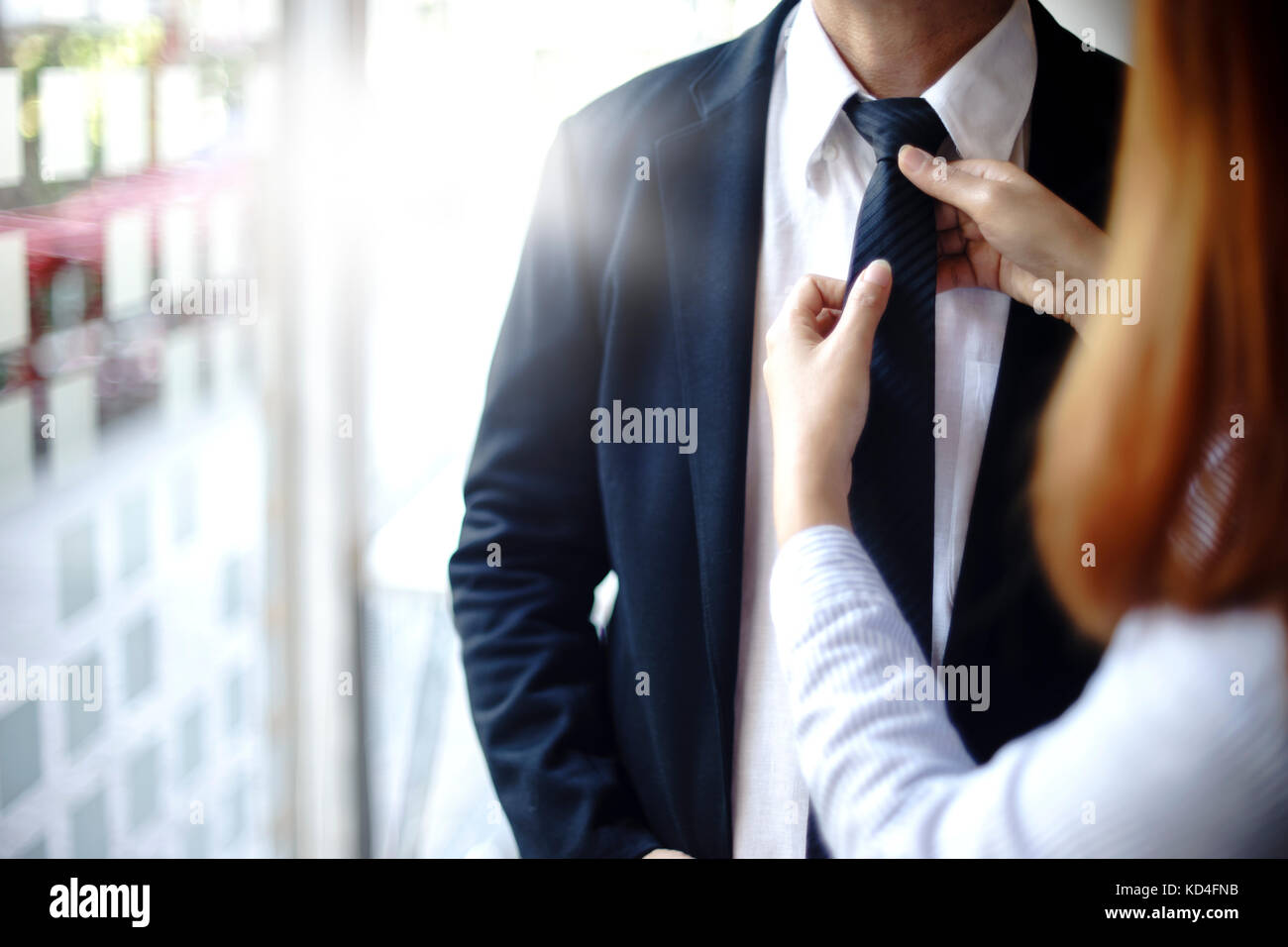 businessman prepare to go to present the project and the assitant help to adjust necktie Stock Photo