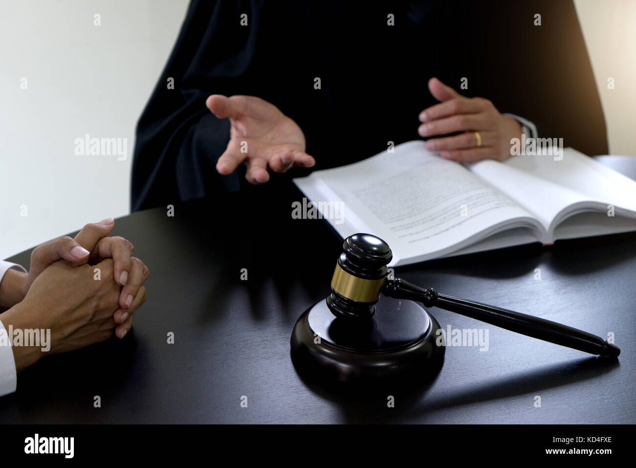 Judge gavel with Justice lawyers Plaintiff or defendant  meeting at law firm in background. Concept of law. Stock Photo