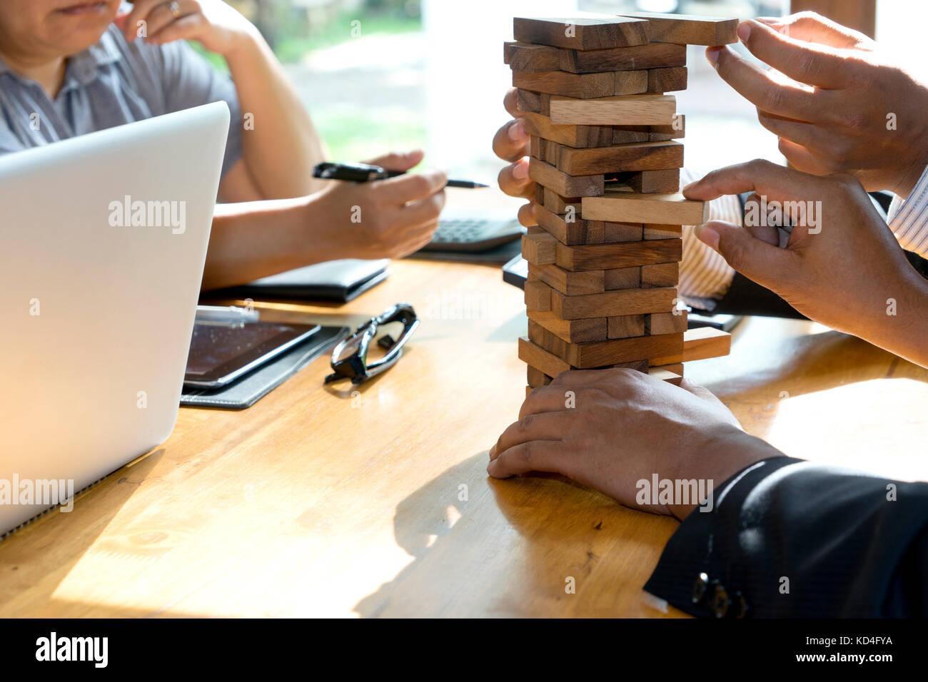 man and woman play wood material toy block for develop thinking and activity Stock Photo