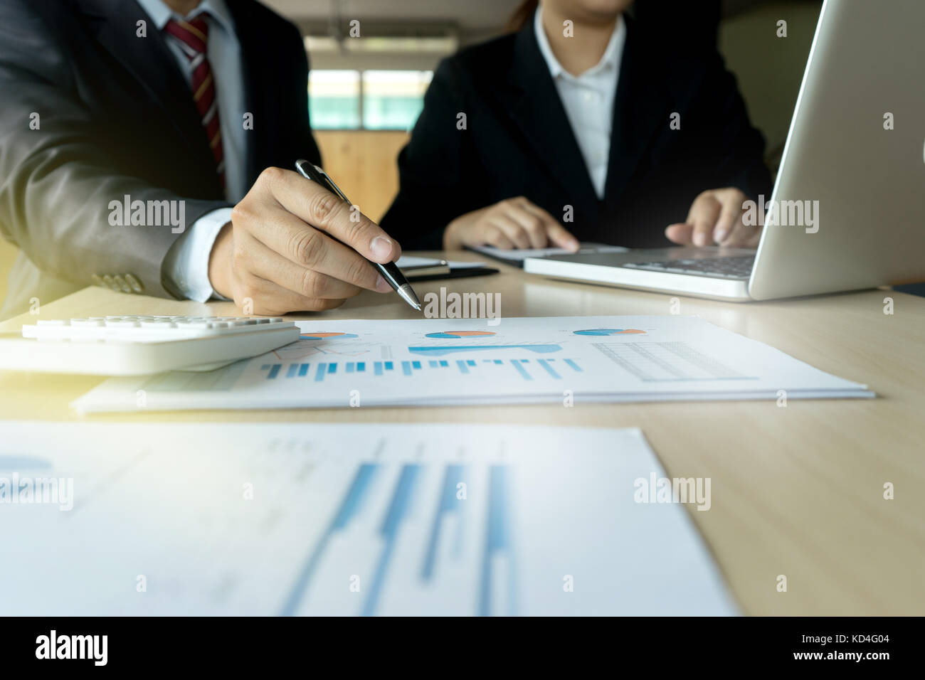 businessman working on paper to proof for maket plan Stock Photo