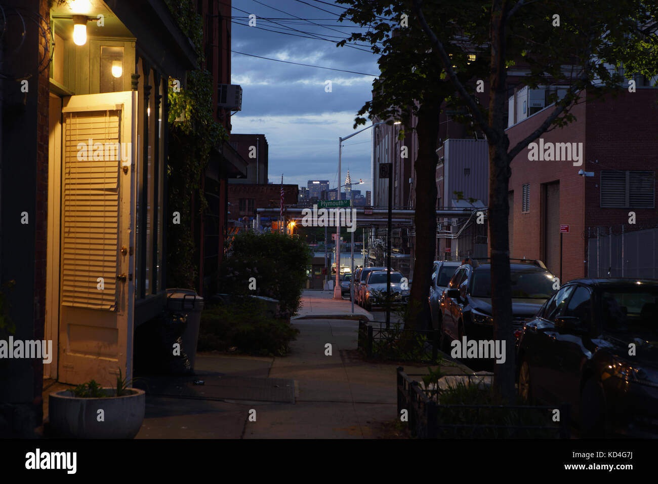 Darkness down a Vinegar Hill backstreet near DUMBO Brooklyn. Old houses on Hudson Avenue in Vinegar Hill, Brooklyn, New York. Vinegar Hill is located  Stock Photo