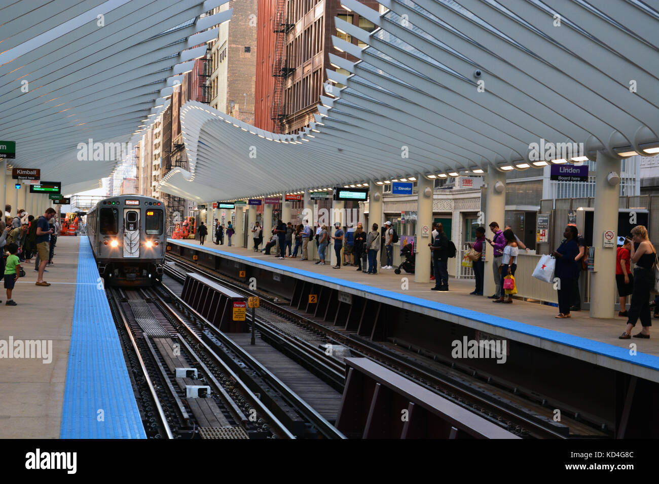 The modern downtown 'L' train station at Washington and Wabash provides a fitting entry for tourists visiting Millennium Park in Chicago. Stock Photo