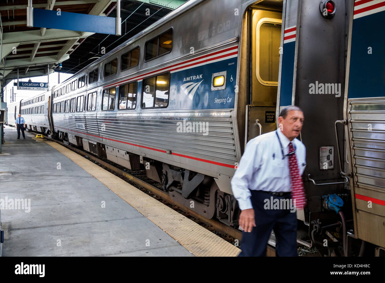 Washington DC,District of Columbia,Union Station,railroad,train,Amtrak,sleeping car cars,conductor,adult adults man men male,platform,visitors travel Stock Photo