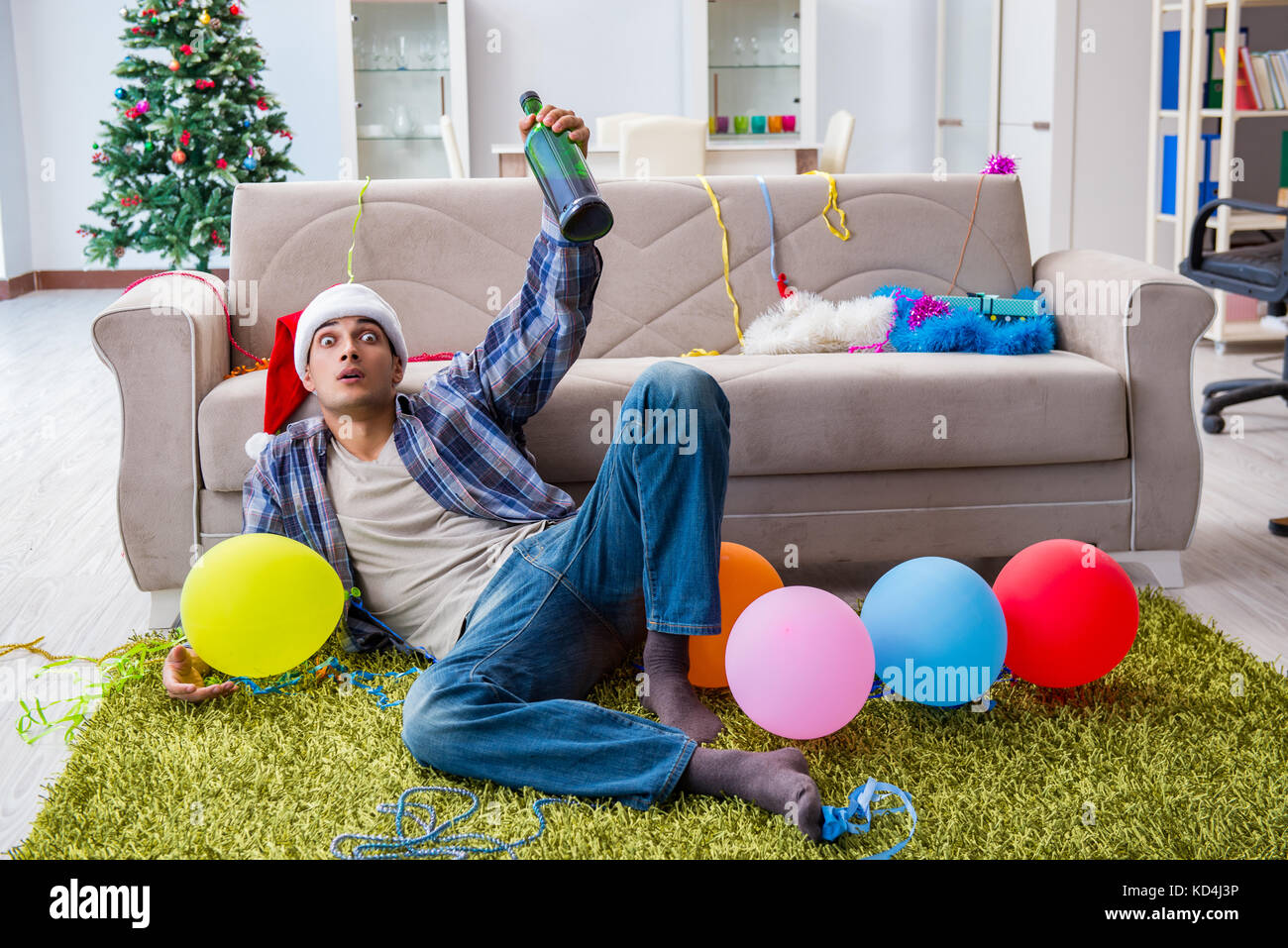Man having hangover after christmas party Stock Photo Alamy