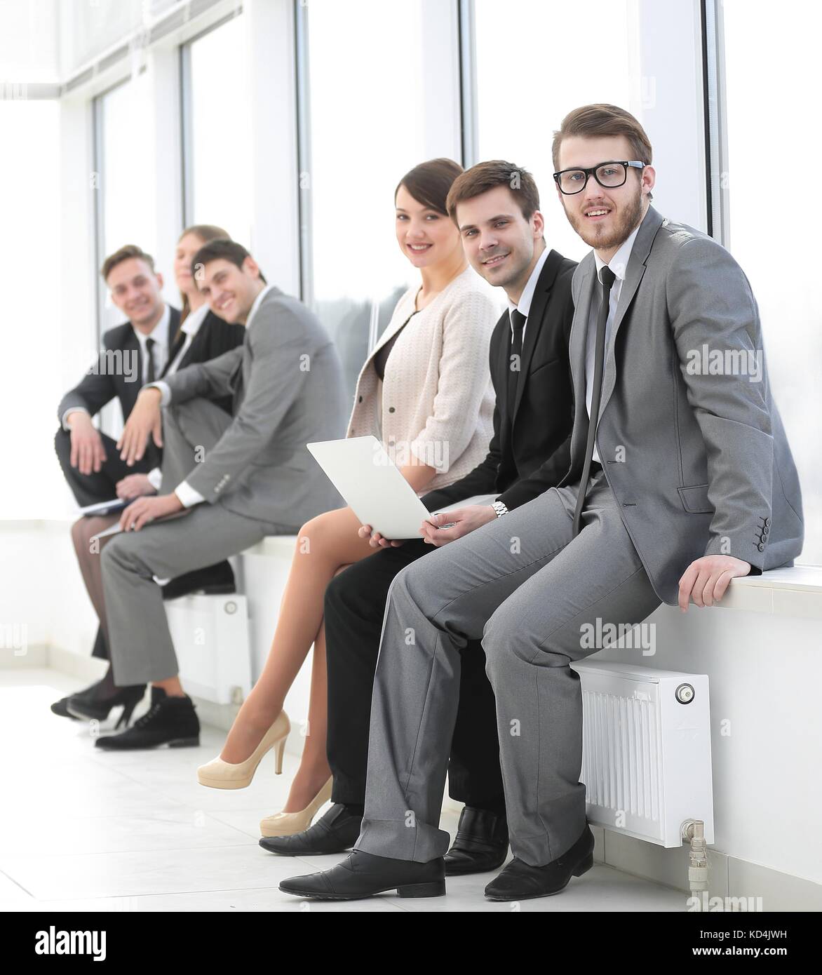 business team sitting in the lobby of the office Stock Photo - Alamy