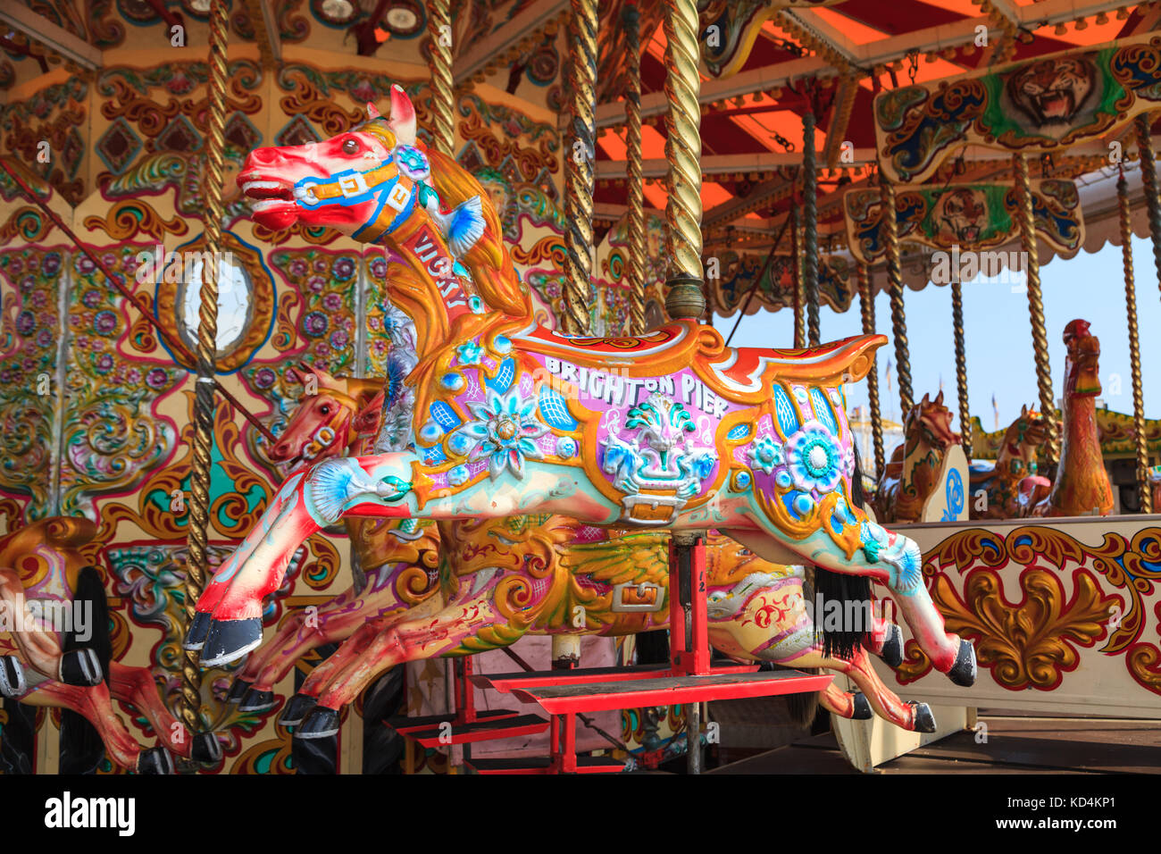 Painted antique wooden horse on a traditional Victorian British seaside carousel fairground ride, England, UK Stock Photo