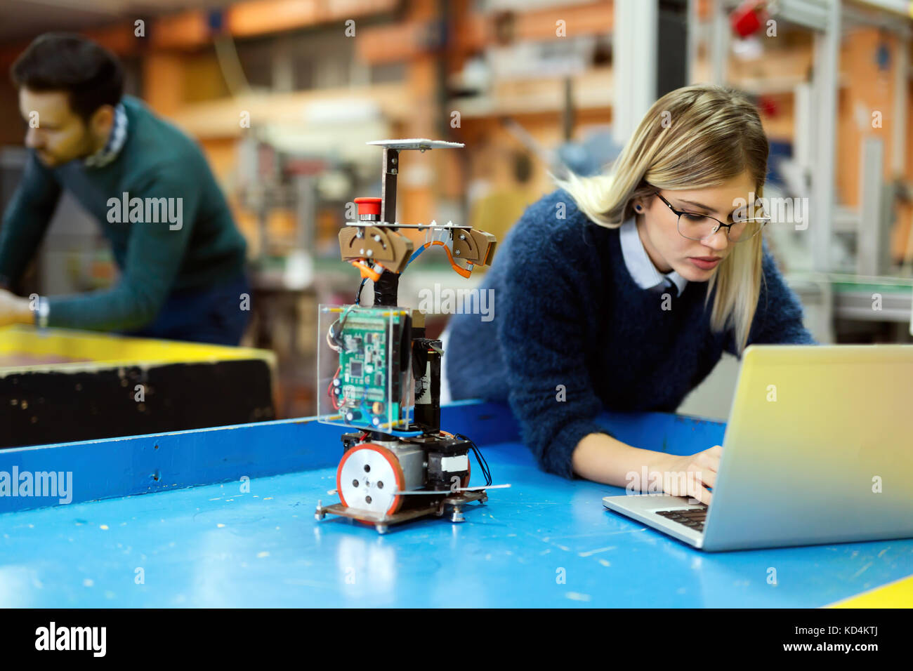 Young beautiful female engineer testing and programming Stock Photo