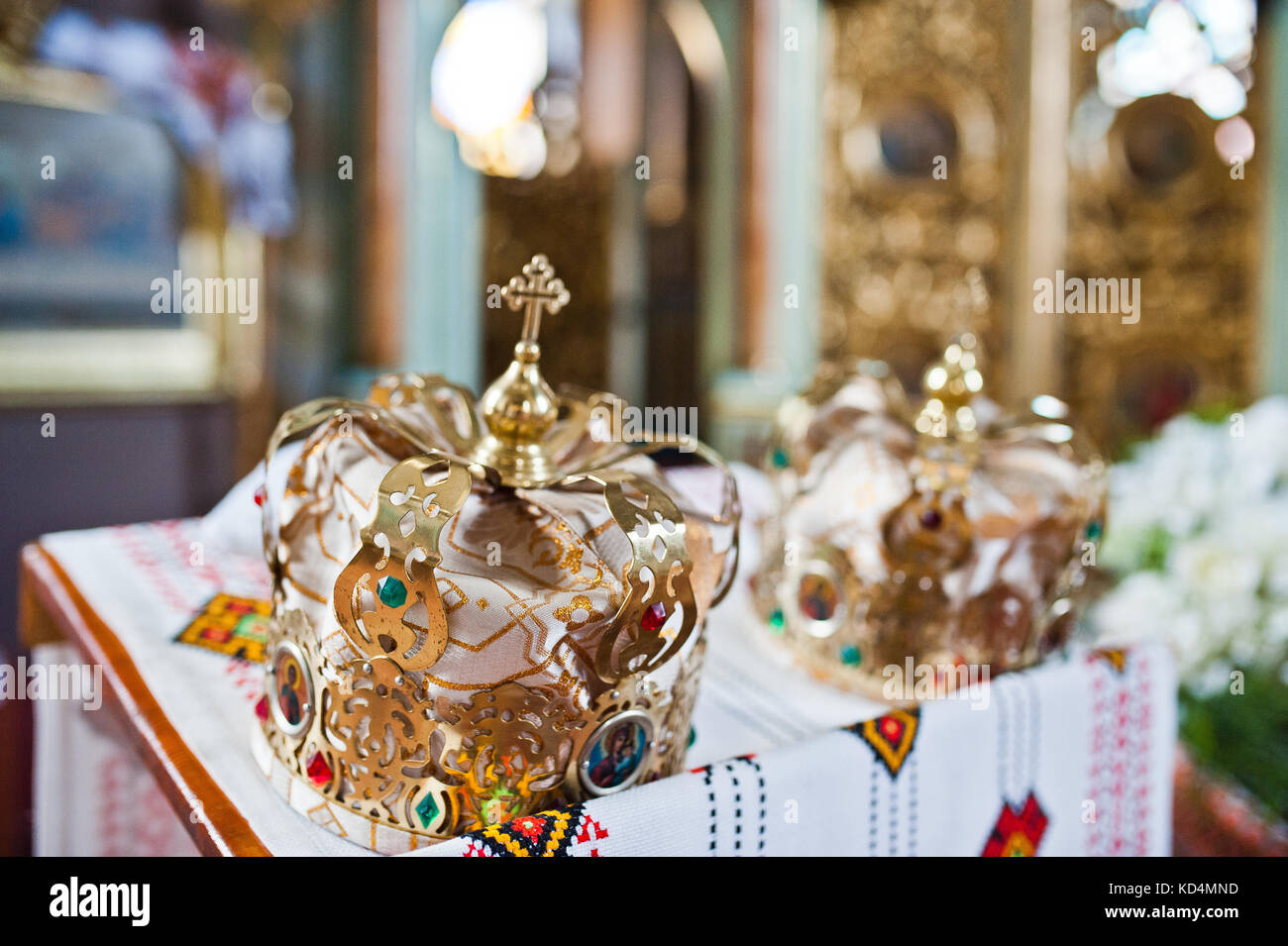 Close-up photo of wedding crowns in the church on the table Stock Photo ...