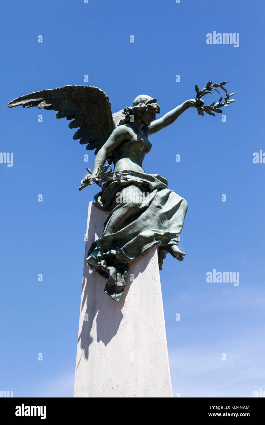 Angel perched atop an obelisk, Recoleta Cemetery, Buenos Aires, Argentina, South America Stock Photo