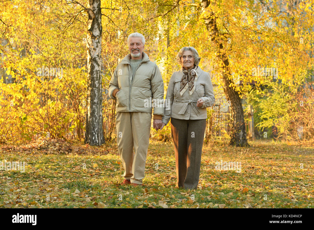 couple walking in the park Stock Photo - Alamy