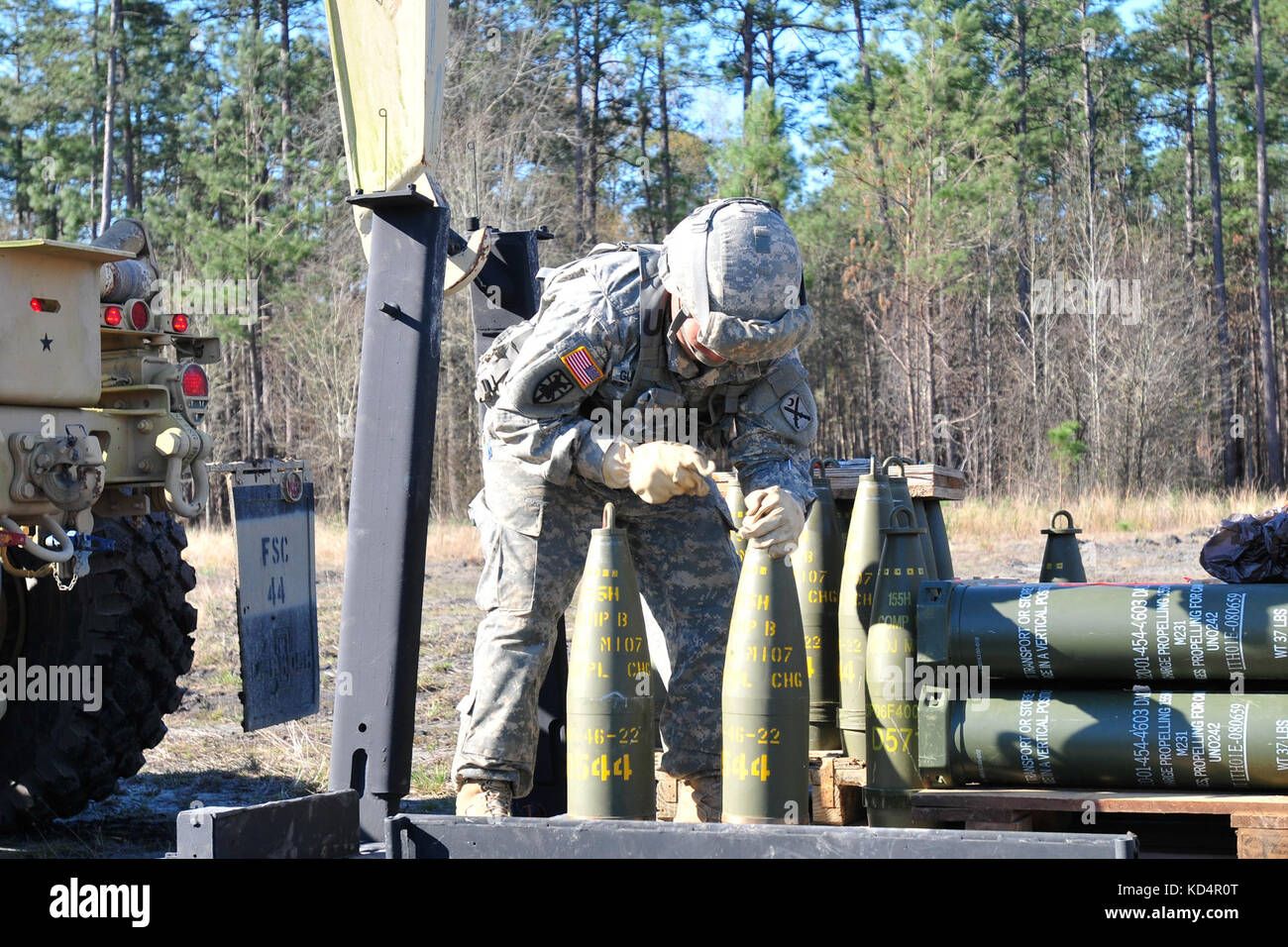 Sgt. Fabian Gutierrez, ammuntitions sergeant with the 178th Field Artillery Battalion, A Battery, South Carolina Army National Guard, prepares ammunitions for distribution to the guns during their annual training on the firing ranges at Fort Stewart, GA. The 178th focus for training is on manual gunnery, a skill seldom used with today’s technology, but very important for when computers go down and technology doesn't work. (U.S. Army National Guard photo by OC Tracci Dorgan/Released) Stock Photo