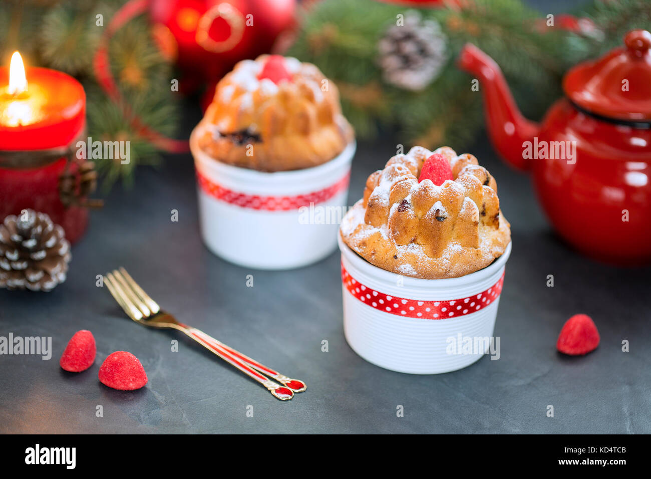 Mini Bundt Cherry Cakes Sprinkled With Powdered Sugar Candles Stock Photo Alamy
