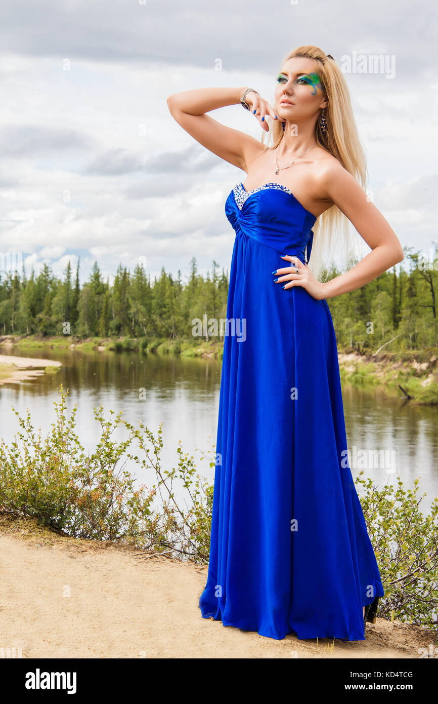 Beautiful young woman near the river Stock Photo - Alamy