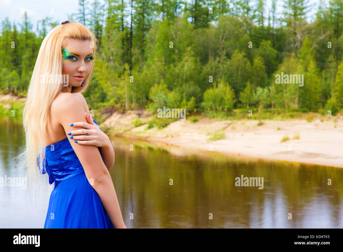 Beautiful young woman near the river Stock Photo - Alamy