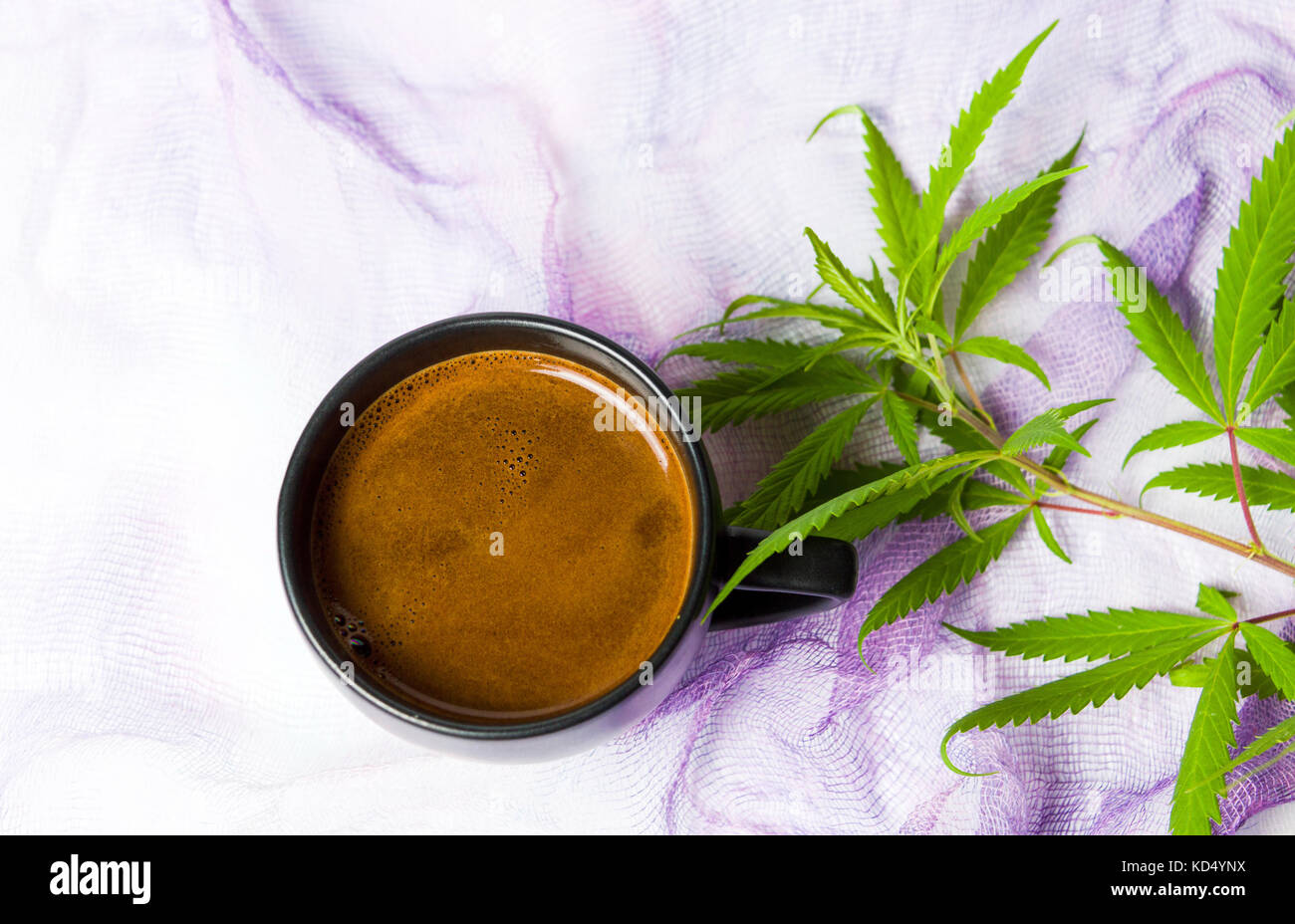 Coffee with green marijuana leaf top view Stock Photo
