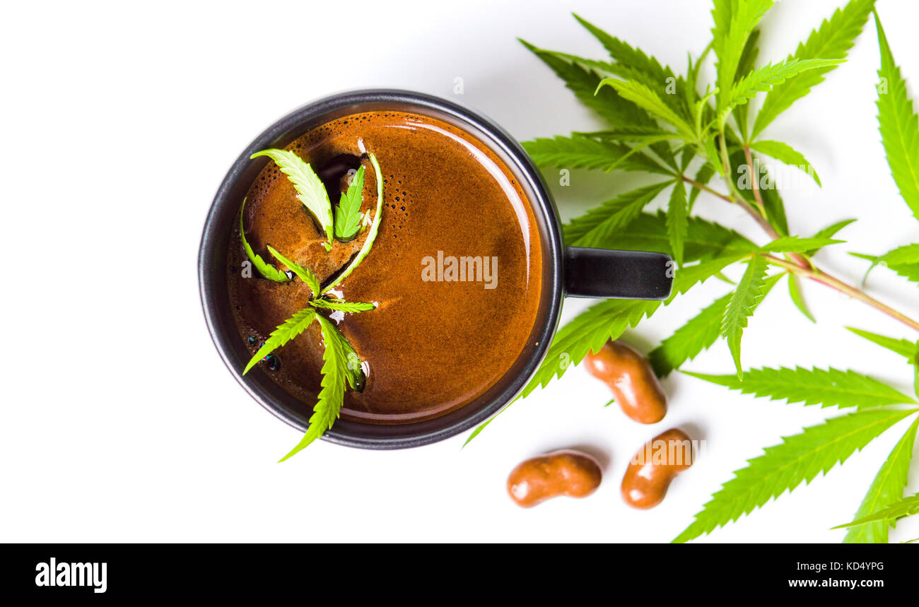 Coffee with green marijuana leaf top view Stock Photo