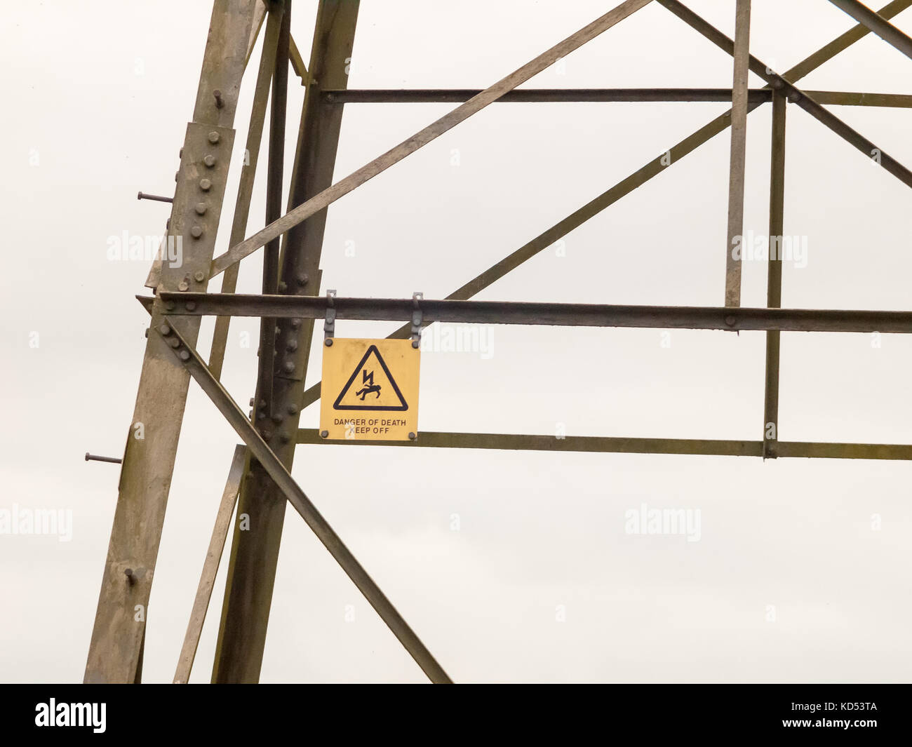 metal pylon electrical tower sign detail danger hazard yellow death; essex; england; uk Stock Photo