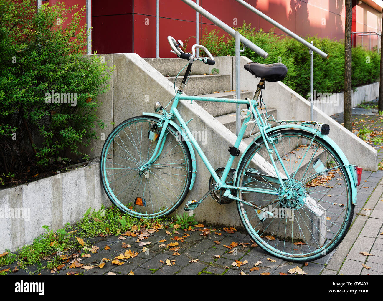 painted bicycle locked to railing Stock Photo