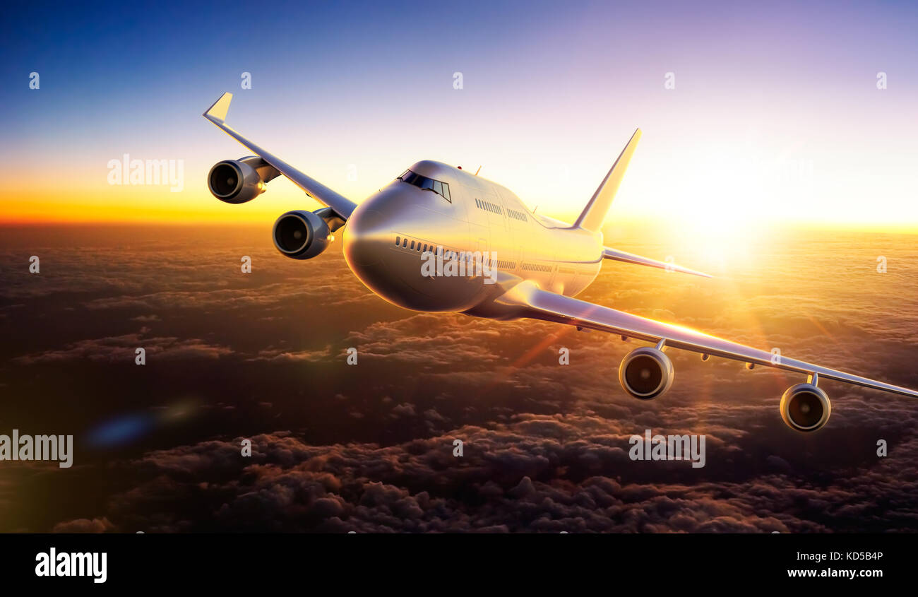 Airplane flying above clouds during sunset Stock Photo - Alamy