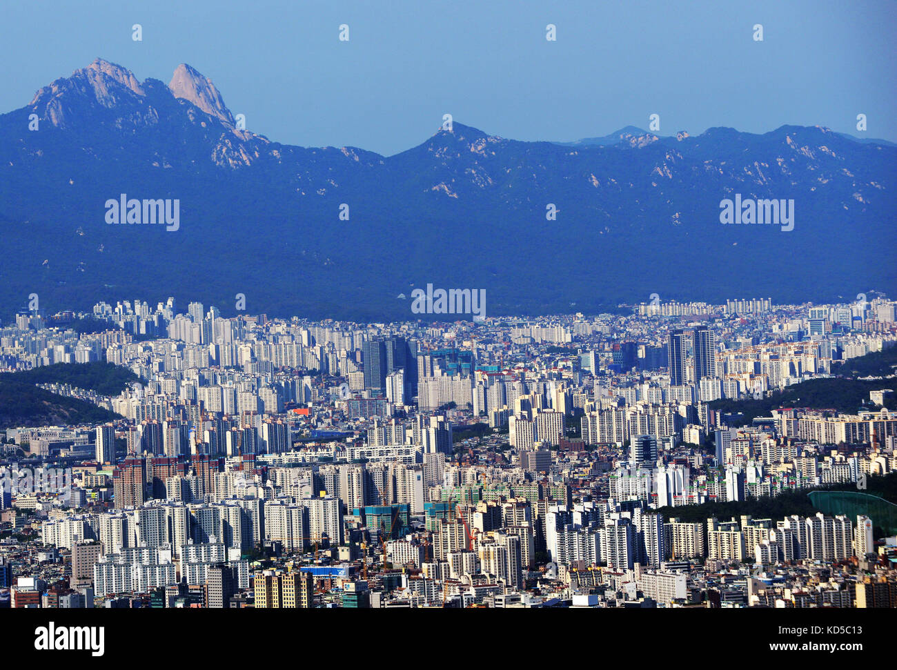 The capital city of Seoul surrounded by mountains. Stock Photo