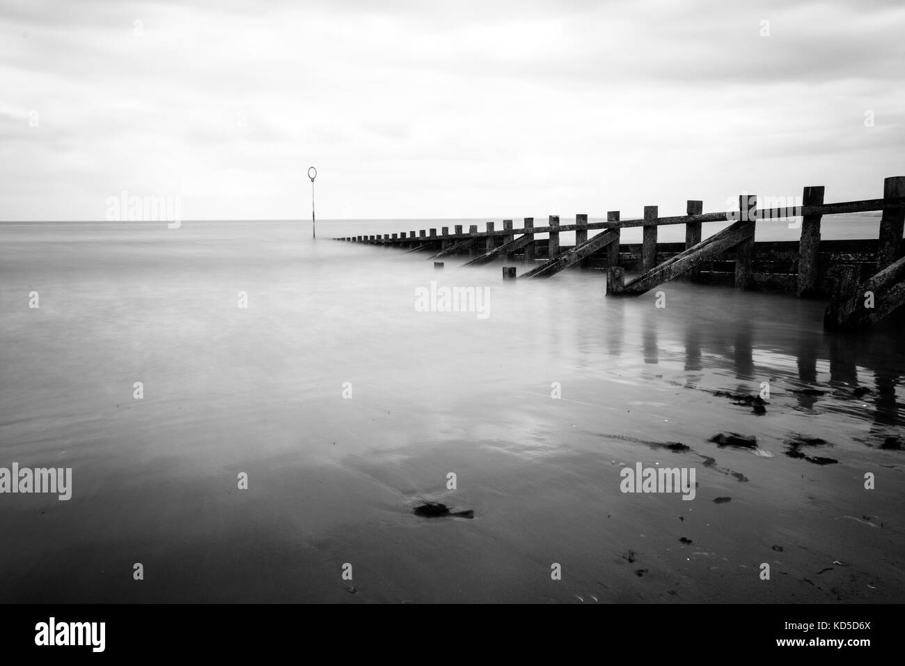 Long exposure at Portobello beach with groynes and a calm sea and