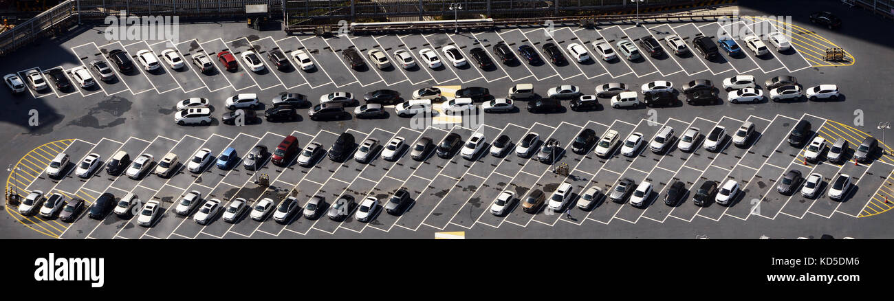 An aerial view of a parking lot with many parked cars. Stock Photo