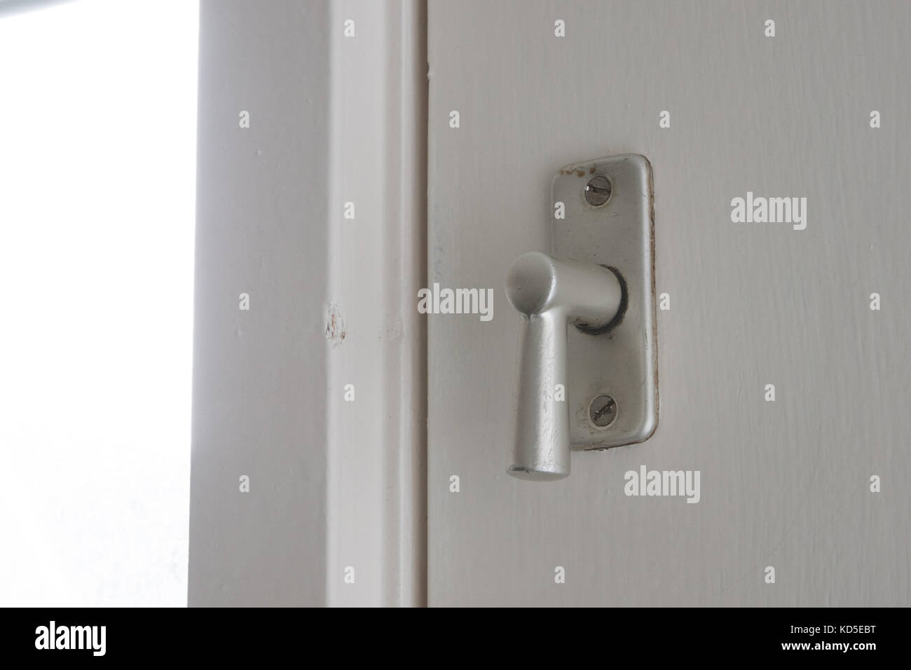 White door with security lock doorhandle, selective focus Stock Photo ...