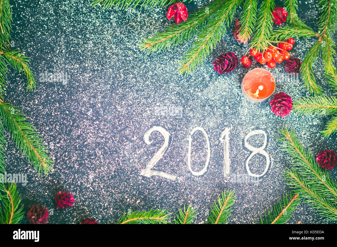 New Year composition with fir-trees, cones and candles Stock Photo - Alamy