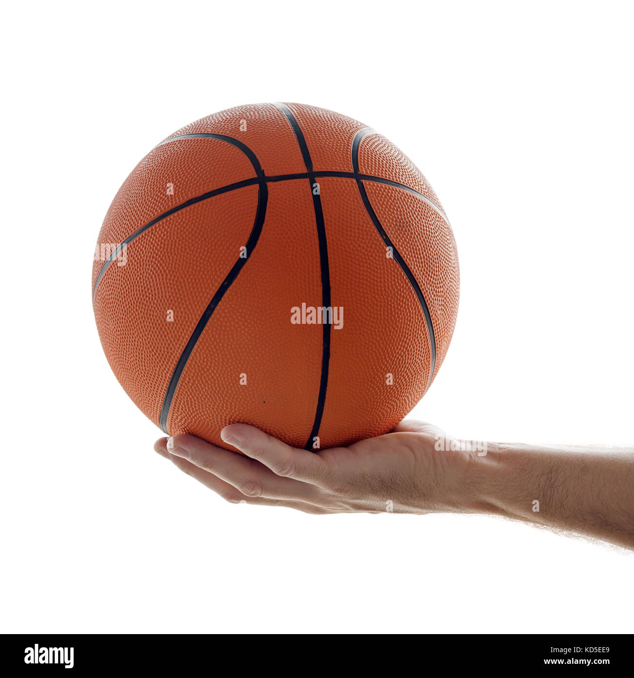 Sport and recreation, man holding basketball. Isolated on white background. Stock Photo