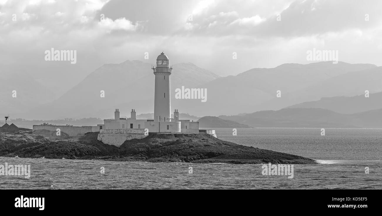 Scottish landscape with Lismore Lighthouse on Eilean Musdile islet, viewed from the Mull to Oban ferry in the Firth of Lorne, Inner Hebrides, Scotland Stock Photo