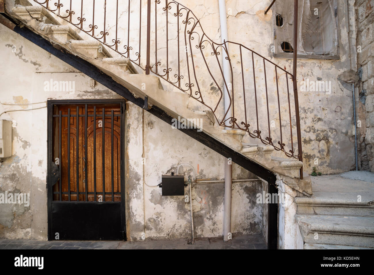 Traditional stair entrance with broken handle of Lebanese house in Tyre, Lebanon Stock Photo