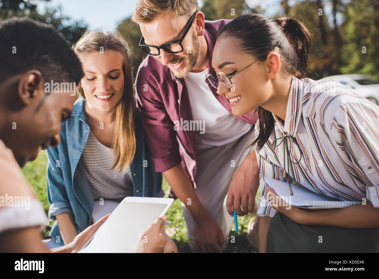 multiethnic students with digital tablet Stock Photo - Alamy