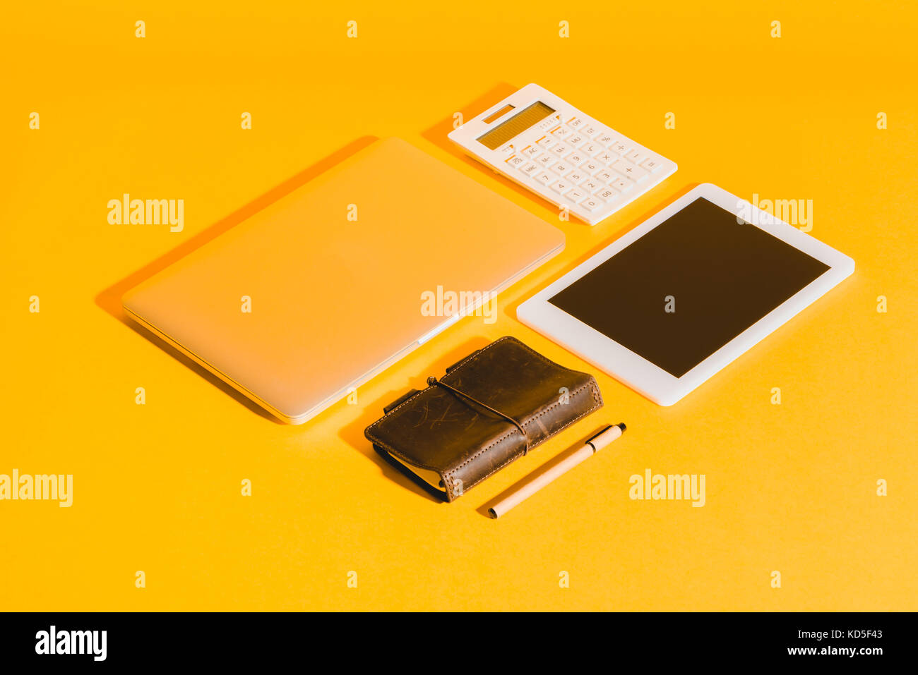 digital devices on yellow Stock Photo Alamy