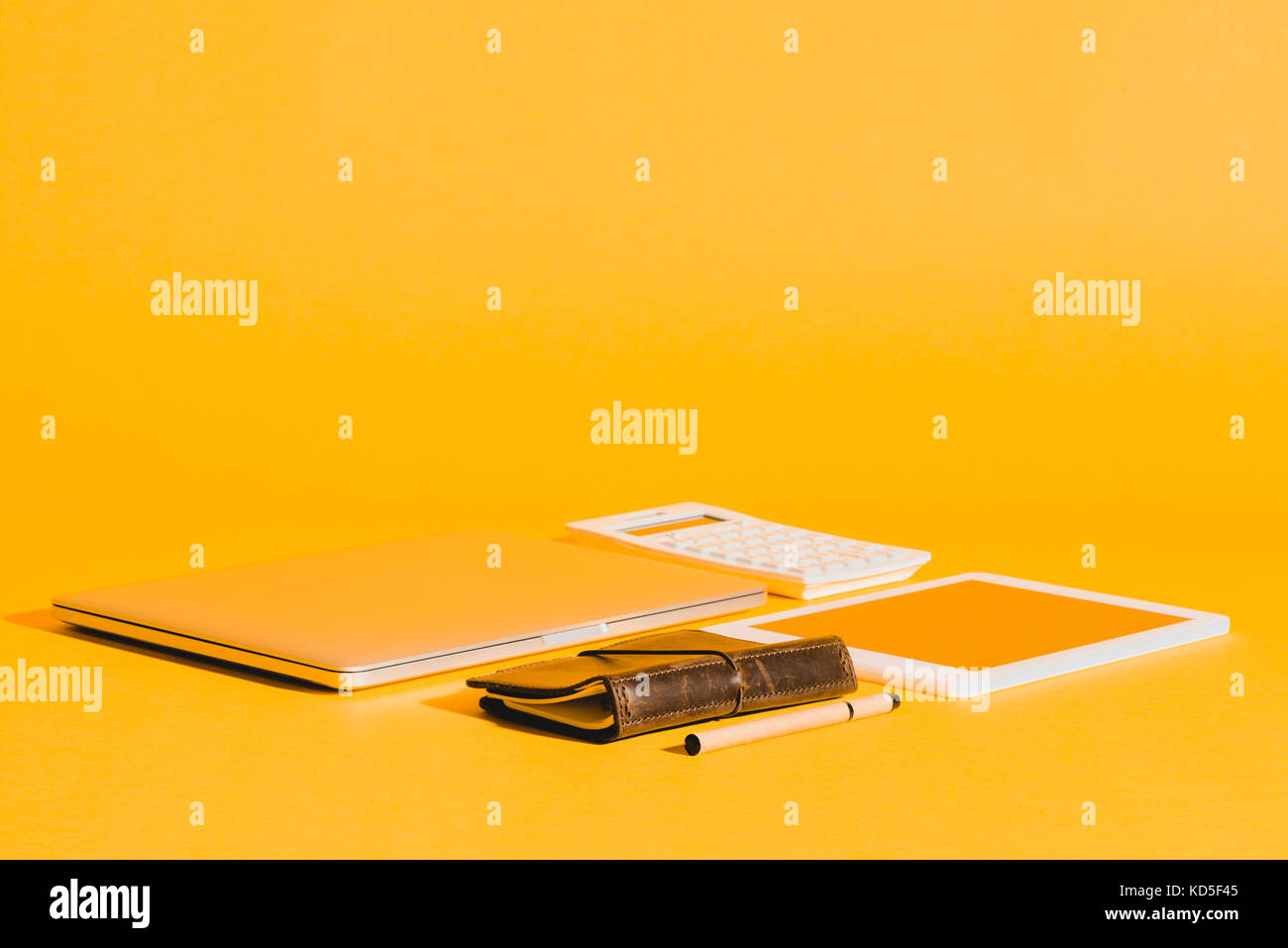 digital devices on yellow Stock Photo Alamy