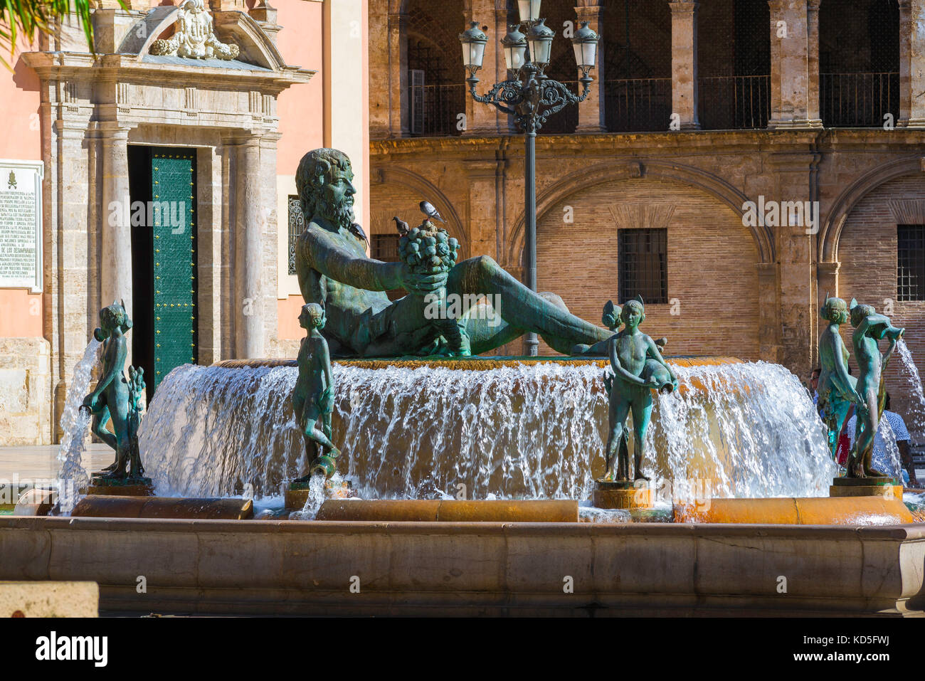 Valencia Plaza, statue of Neptune on the Turia Fountain in the Plaza de la Virgen in the centre of Valencia, Spain. Stock Photo