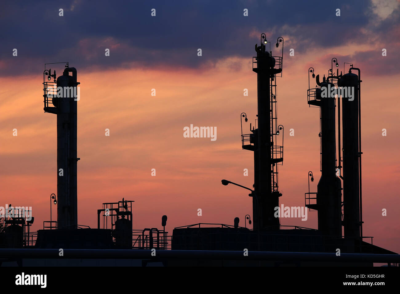 twilight over petrochemical plant silhouette Stock Photo - Alamy