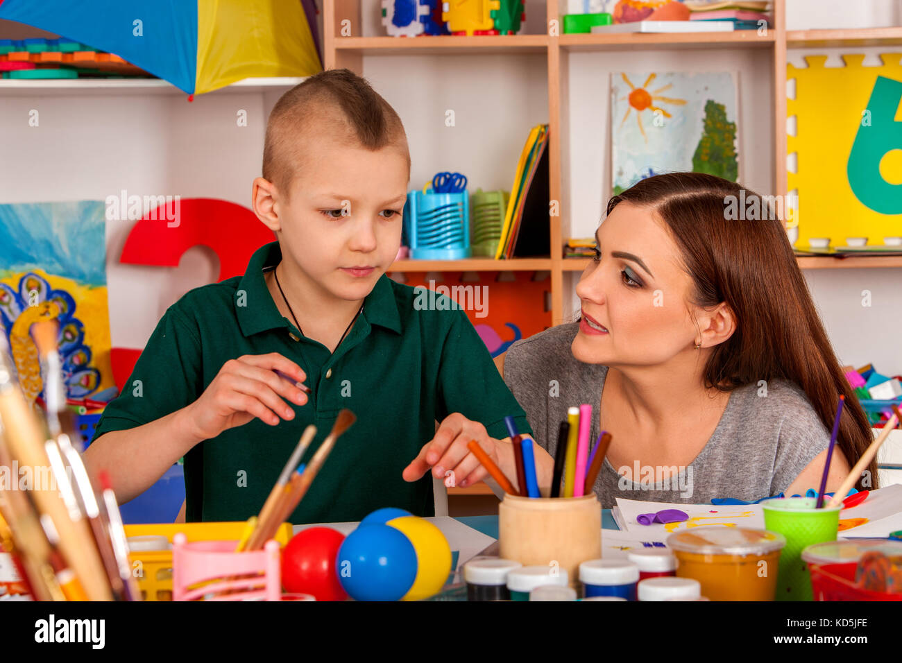 Small students girl and boy painting in art school class Stock Photo ...