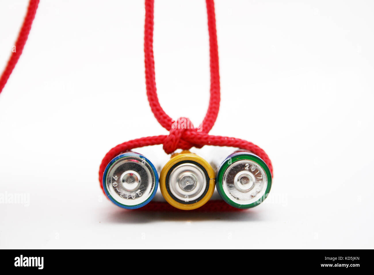Battery bound with red rope. Energy concept Stock Photo - Alamy