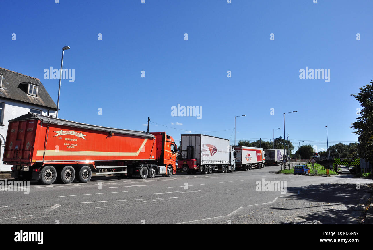 Lorries queued up at the railway level crossing, Ely, Cambridgeshire, England, UK Stock Photo