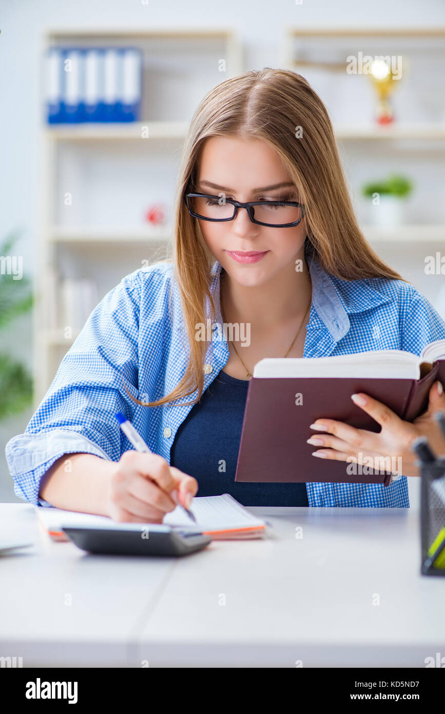 Young teenage female student preparing for exams at home Stock Photo ...
