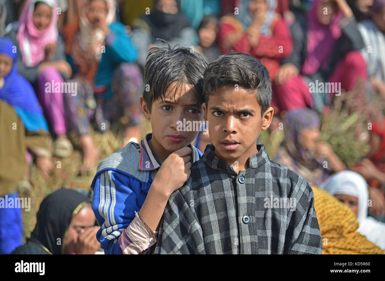 India. 10th October,  2017. Kashmiri boys attend the funeral of a local militant Irfan Ahmad in Heff area of Shopian some 60 kilometers from Srinagar the summer capital Kashmir. Three militants were killled in an encounter with Indian forces in Gatipora area of south Kashmir's Shopian.Police said Credit: Faisal Khan/Pacific Press/Alamy Live News Stock Photo