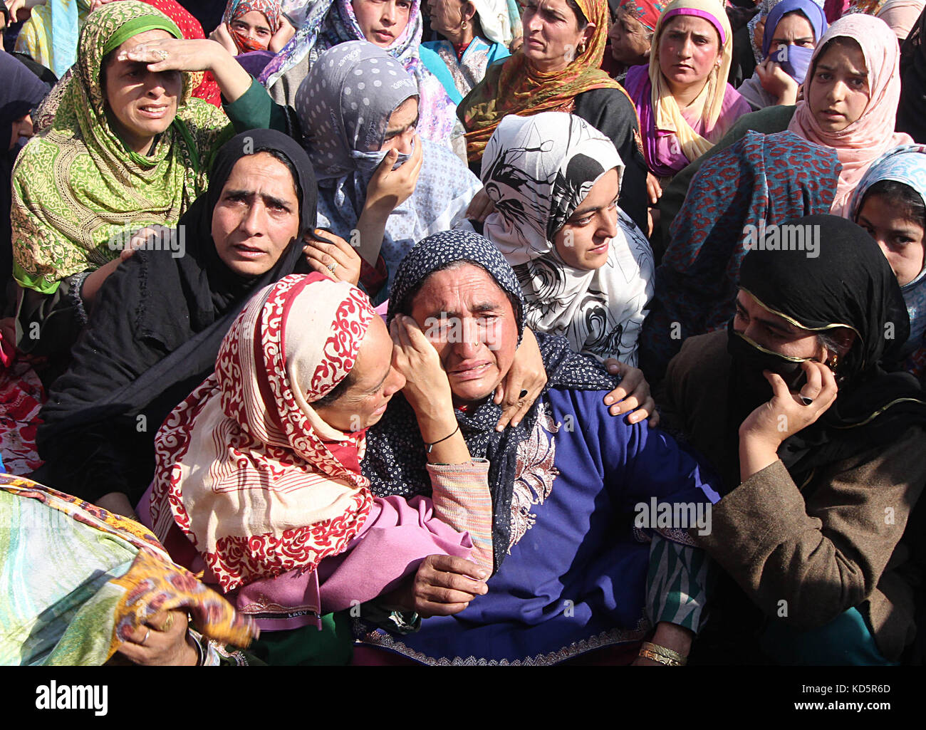 India. 10th October,  2017. Kashmiri women weep during the funeral of a local militant Irfan Ahmad in Heff area of Shopian some 60 kilometers from Srinagar the summer capital Kashmir. Three militants were killled in an encounter with Indian forces in Gatipora area of south Kashmir's Shopian.Police said Credit: Faisal Khan/Pacific Press/Alamy Live News Stock Photo