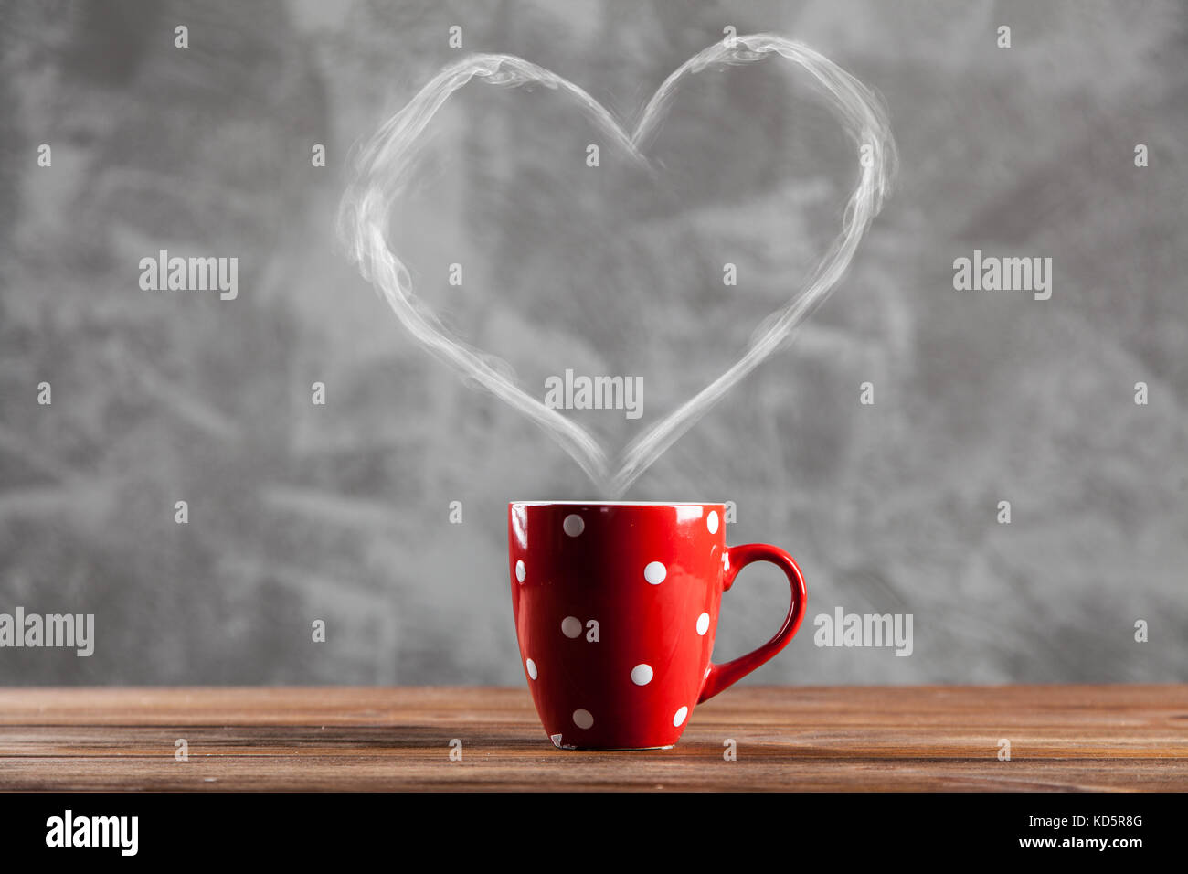 Cup of coffee with a heart shaped steam Stock Photo - Alamy