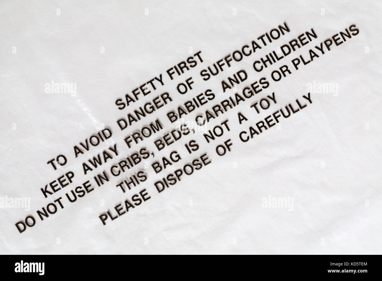 Safety first to avoid danger of suffocation keep away from babies and children do not use in cribs beds carriages or playpens this bag is not a toy Stock Photo