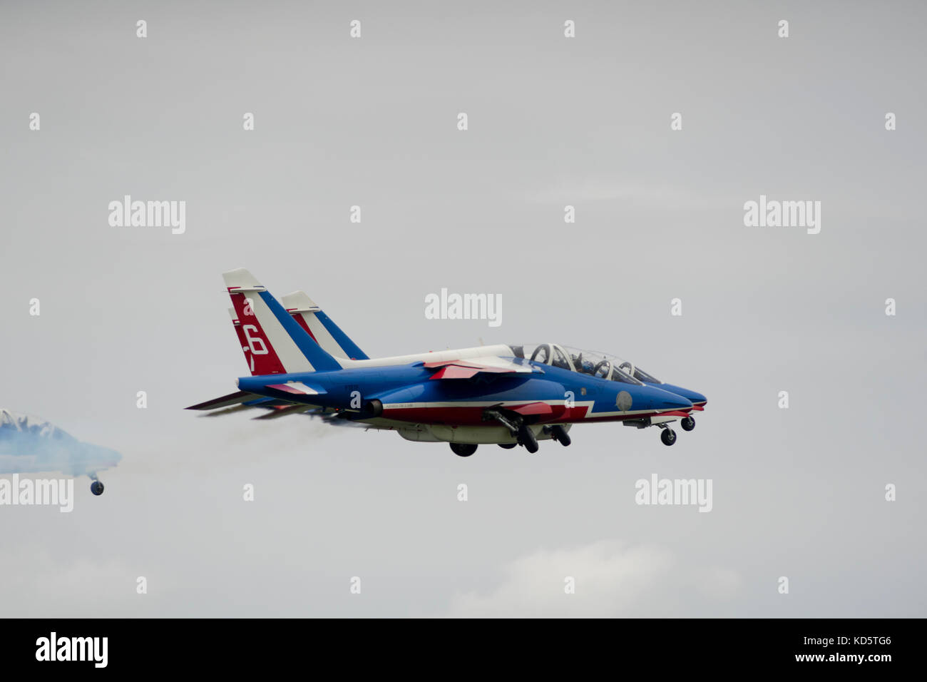 Members of the French aerobatic team Patrouille de France are taking off for an air show. Stock Photo