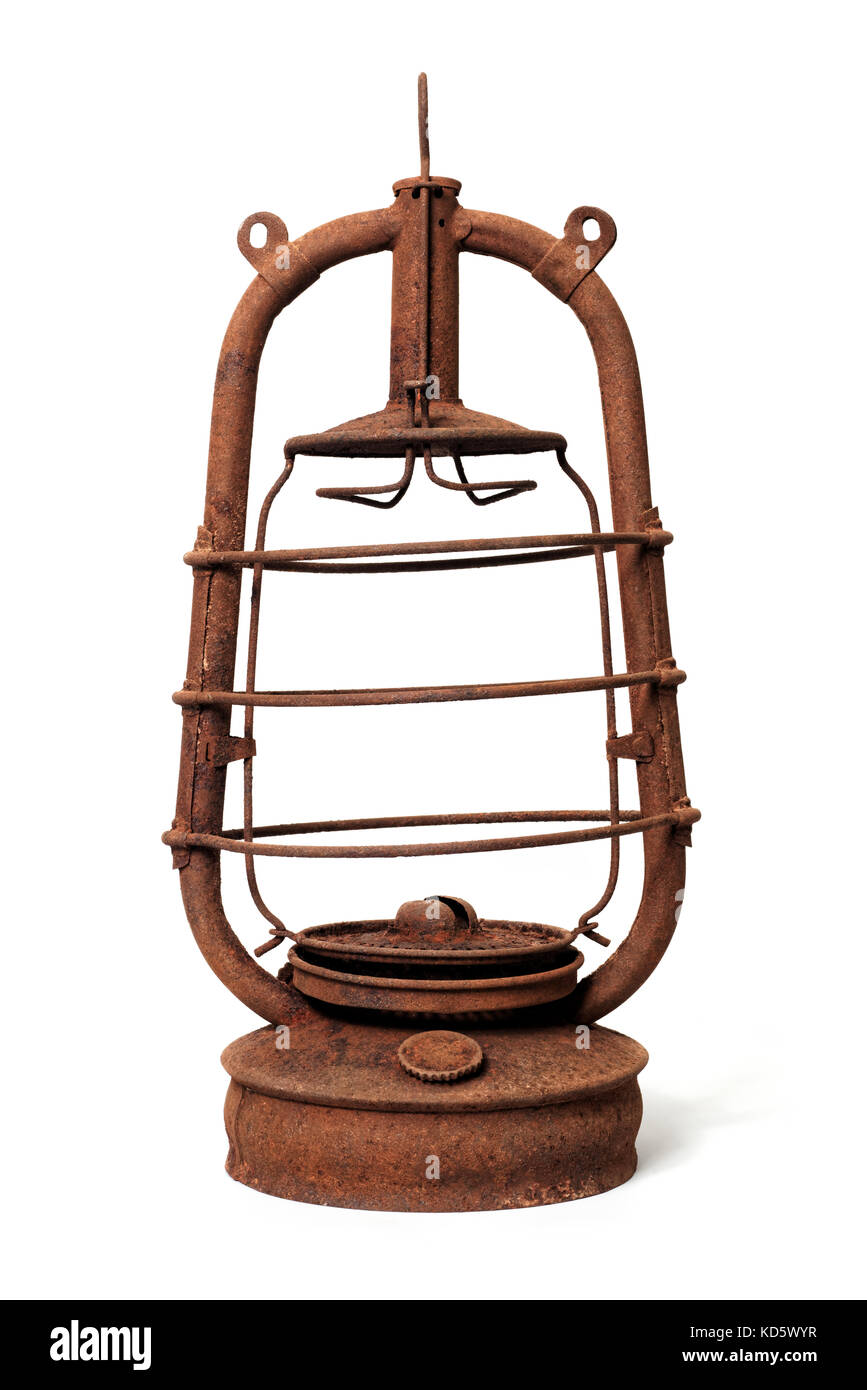 Isolated objects: very old shabby and rusty kerosene lamp, without glass, on white background Stock Photo