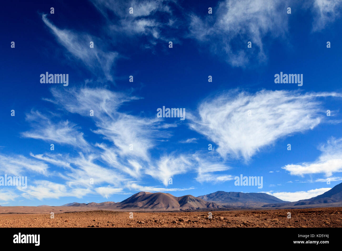 Unusual funnel shaped cirrus cloud formations on the border of the Atacama desert between Chile and Bolivia, near San Pedro de Atacama, South America Stock Photo