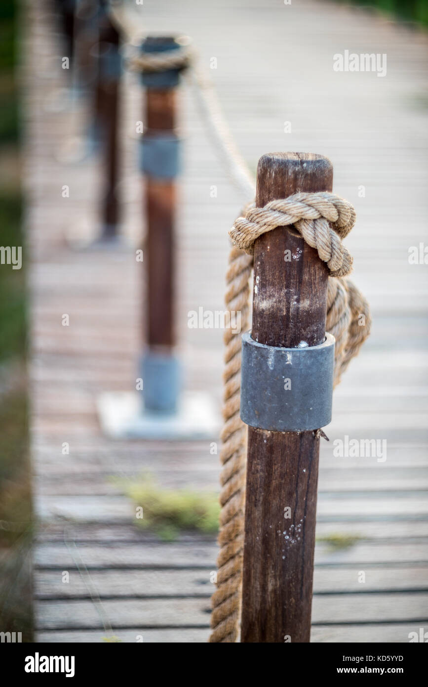 Old rope tied wooden pole hi-res stock photography and images - Alamy