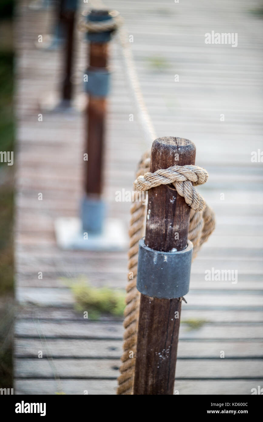 Old rope tied wooden pole hi-res stock photography and images - Alamy